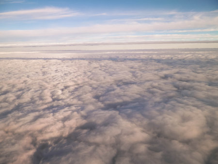 Cloudscape form plane. Flying above the clouds.