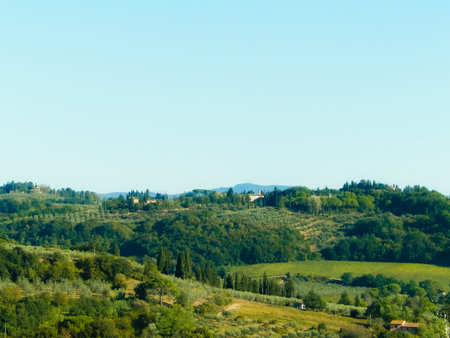 Hills, fields and meadows - typical views of Tuscany, Italy. Travel, nature and agriculture concept. Sunny autumn day, vacations in Italy. Copy space.の写真素材