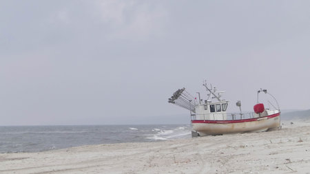 Boat on baltic sea shore in winter. Krynica, Piaski close to the Russian border Poland