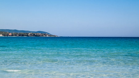 Coast and beach in Vada, Italy. Transparent, turquoise water and white sand. Travel and nature concept.の写真素材