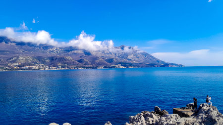 Tourists enjoying view of coast near Zvala. Spring in Montenegro. Travel concept.の写真素材