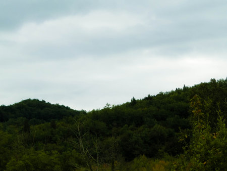 Autumn in Italy - Tuscan hills on a cloudy day. Copy space on cloudy sky.の写真素材