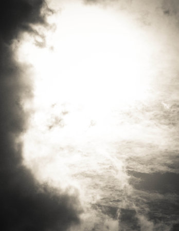 Sun hiding behind the clouds. Weather concept.の写真素材