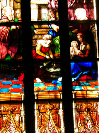 Biblical scenes on stained glass. Arch-see in Frombork. Art background. St. Andrew in Frombork Cathedral.の写真素材