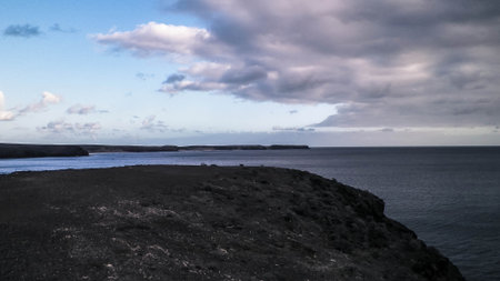 Coastal area, cliffs in Playa Blanca, Lanzarote, Canary Islands. Travel and nature concept.の写真素材