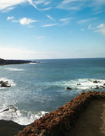 Cliffs over El Golfo Beach. Lanzarote Island. Popular touristic attraction.