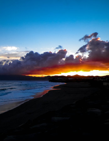 Beautiful sunset over beach in Ribiera Grande, Atlantic Ocean, Azores Islands. Travel and nature...