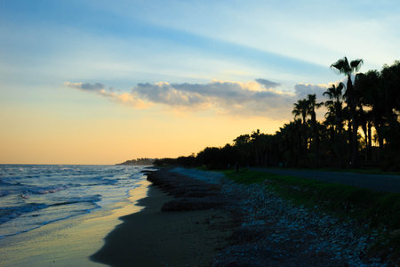 Coast of tropical Perivolia beach in Cyprus at sunset.の写真素材