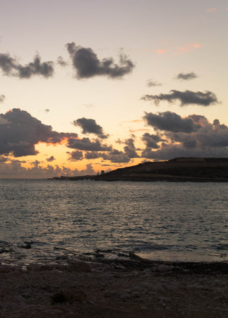 Stunning sunset or sunrise sky over Mediterranean sea. Beautiful nature of Malta Marfa Peninsula.の写真素材