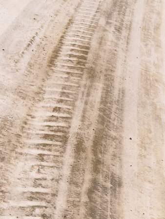 Tire tracks on the snow-covered road.
