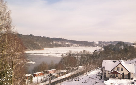 Mountain house on the coast of Ostrzyckie Lake in winter. Wiezyca Poland.の写真素材