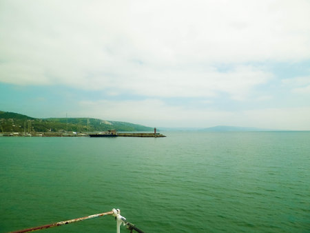 View on marina and coast of Balchik, Bulgaria. Stormy weather over Black sea coast, traveling and nature concept.の写真素材