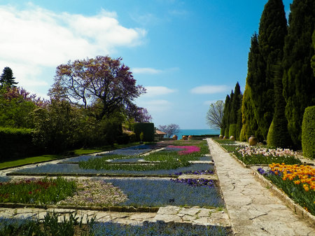 Alley in the gardens of the Balchik Palace, Dobrich province, Bulgaria. Summer time, lots of flowers. Tourism concept.の写真素材