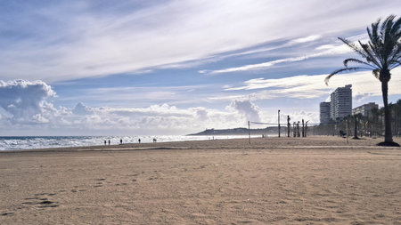 Windy day over beach. Alicante after season. Beauty of nature.
