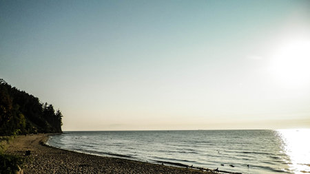 Sunrise over Orlowski Cliff and a beautiful sandy beach by the Baltic Sea, Poland. Polish nature,...