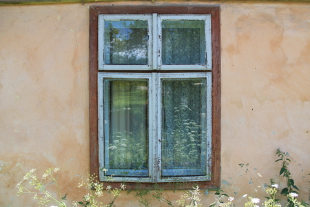 Old wooden window on old (ansient) house.の写真素材