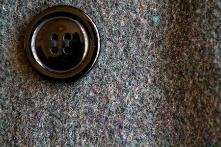 Gray felt with button macro texture for background