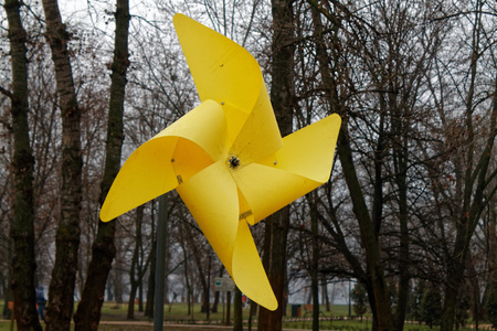 Yellow weathervane Against a gray autumn Sky, wind indicatorの写真素材