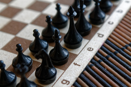 Magnetic Wooden Chess Board and steel chess pieces, isolated on board