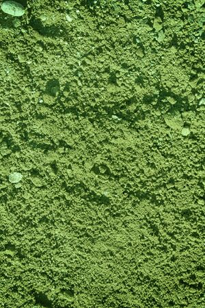 Green Texture of plaster on the wall, cracked background, stone surfaceの写真素材