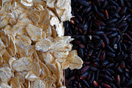 The texture of oatmeal separated with black rice. The concept of proper nutrition and healthy...