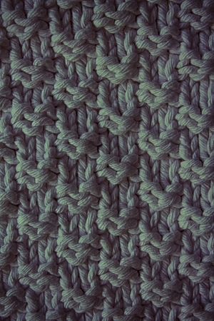The texture of a knitted woolen fabric blue. Background for web site or mobile devicesの写真素材