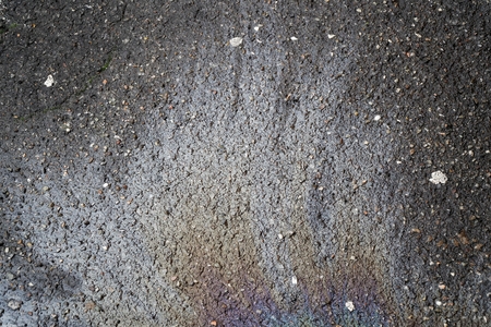 Oil spill on asphalt road, abstract background or texture foe web site or mobile devicesの写真素材