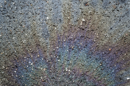 Oil spill on asphalt road, abstract background or texture foe web site or mobile devices.の写真素材