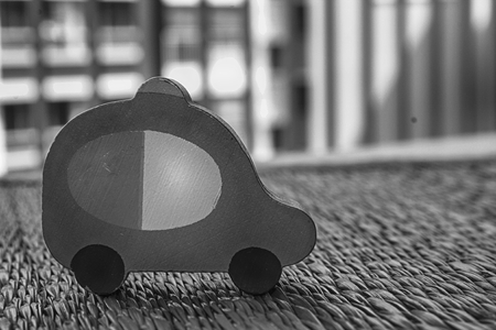 Traditional thai style nature background of monochrome handicraft weave texture wicker surface for furniture material with monochrome toy car on itの写真素材