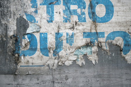 Torn poster after vote on tin textured wall Ripped newspaperの写真素材