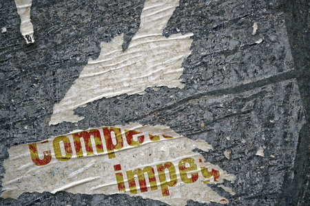 Torn poster after vote on tin textured wall Ripped newspaperの写真素材