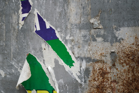 Torn poster after vote on tin textured wall Ripped newspaperの写真素材