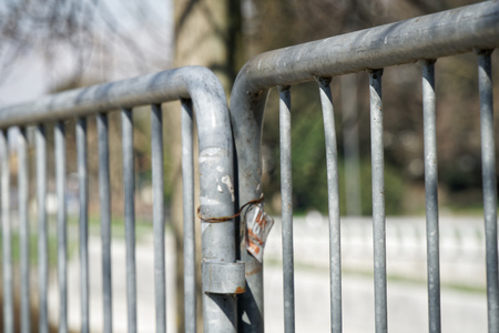 Fence in public park, safety access in entrance.の写真素材
