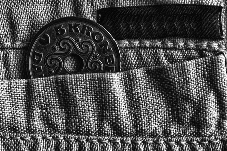 Denmark coin denomination is five krone (crown) in the pocket of old linen pants with black stripe,...