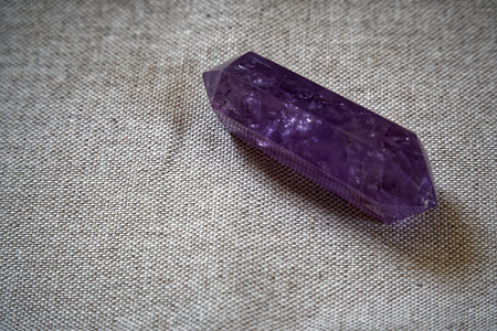 Crystal on linen fabric surface, mock-up for postcard or background for website and mobile devices....