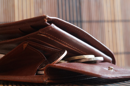 Pile of euro coins in leather brown wallet