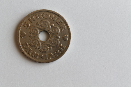 One Denmark coin lie on isolated white background Denomination is 5 krone (crown)の写真素材