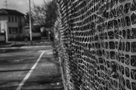 Construction site with safety orange fenceの写真素材