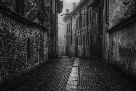 The mistic street in the city, foggy day in Italyの写真素材