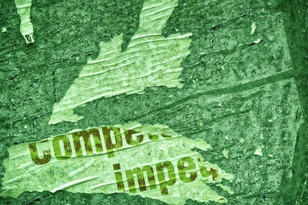 Torn poster after vote on tin textured wall Ripped newspaper.の写真素材