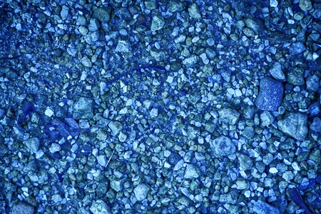 Ultra blue Pebble surface, stone texture or rock backdrop, ground background.