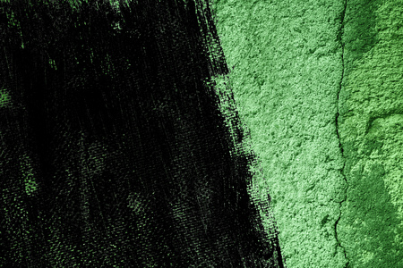 Grunge Ultra green Plaster concrete texture, stone surface, rock cracked background for postcard.の写真素材