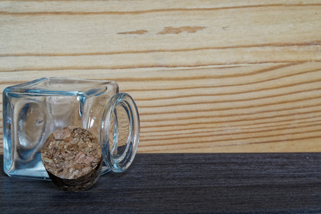 Jar with cork on wooden table, mockup for postcard or greeting card.
