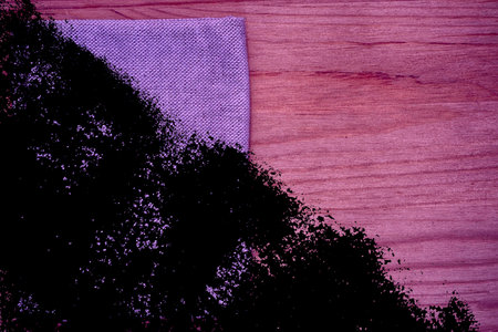 Ultra purple Postcard sample, linen fabric surface on wooden table with free copyspace for greeting...