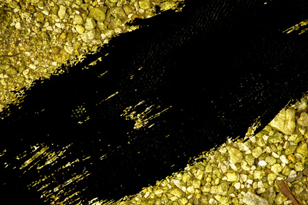 Ultra yellow Pebble surface, stone texture or rock backdrop, ground background.の写真素材