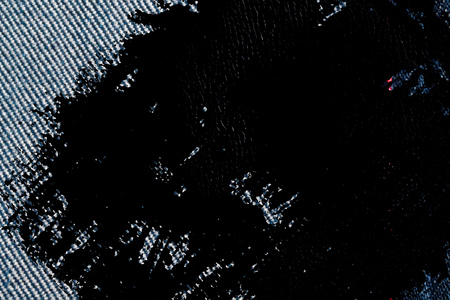 Grunge dirty Denim texture with red seam for jeans background.