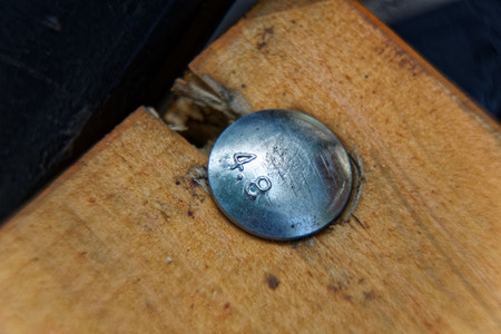 Close-up macro bolt of bench in public park, sunny day, clear weather.の写真素材