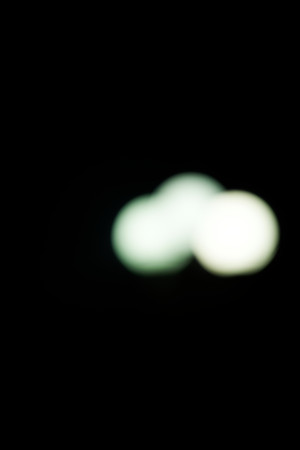 Street lamp bokeh from night city light.