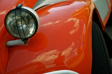 Headlamp of red vintage car, business conceptの写真素材