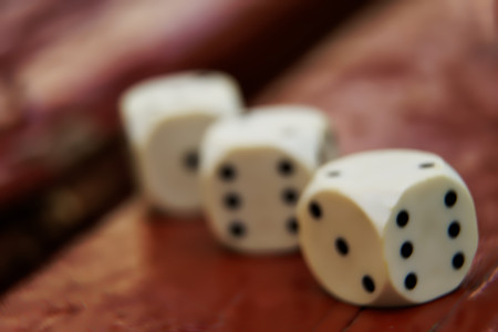 Close-up dice with defocused background, chance for winning.